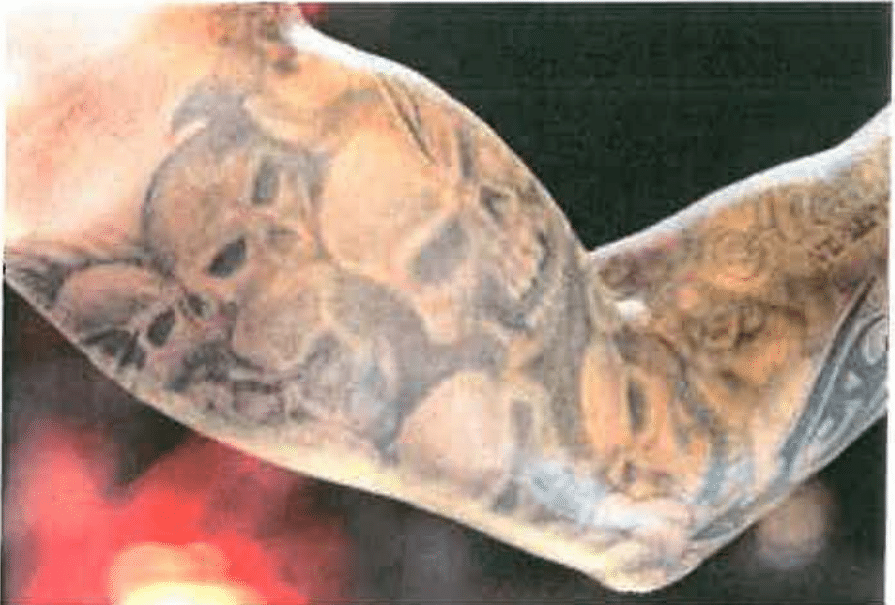 Randy Orton tattoo skull arm design